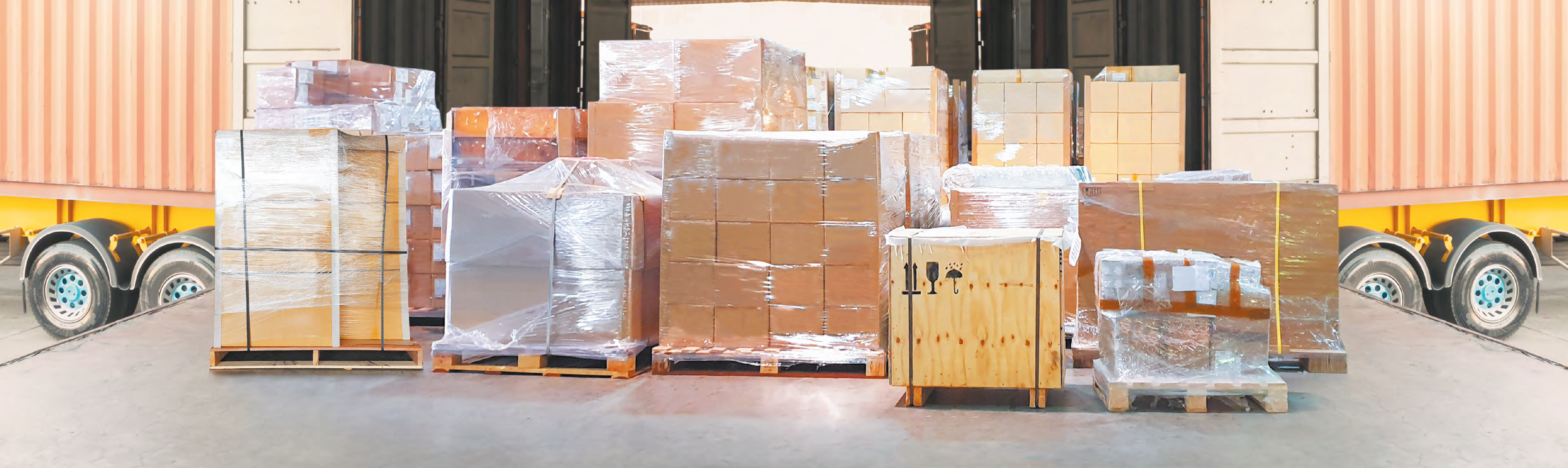 Warehouse pallets and cargo containers at logistics loading dock